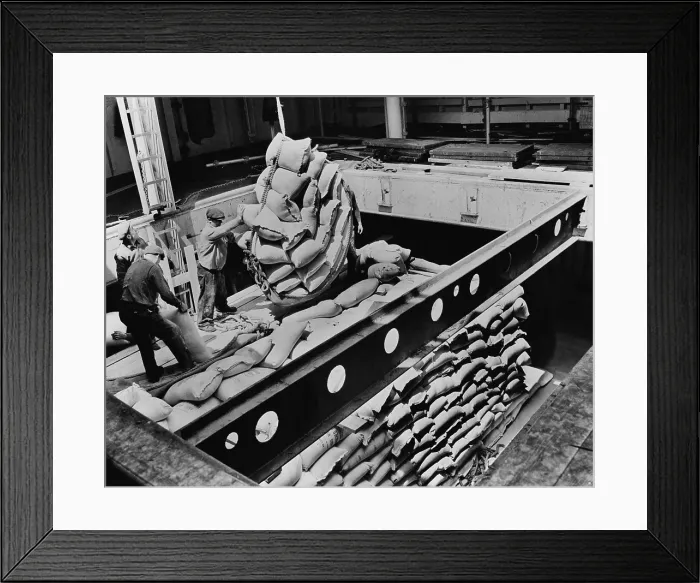 Framed Print : Bags of flour are loaded for shipment to Tunisia from a American port to feed recently liberated Tunisians. Ca. 1943-44 Framed Print : Bags of flour are loaded for shipment to Tunisia from a American port to feed recently liberated Tunisians. Ca. 1943-44