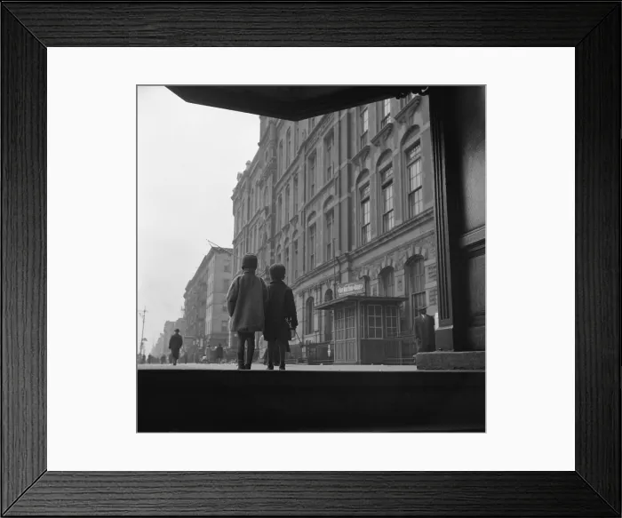 Framed Print : Two young African American children walking closely together on a Harlem street. May 1940 by Gordon Parks