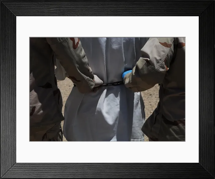 Framed Print : U.S. Sailors both grasping the chain around a detainee's waist escort him to a legal appointment at Camp Delta Guantanamo Bay Naval Base Cuba Framed Print : U.S. Sailors both grasping the chain around a detainee's waist escort him to a legal appointment at Camp Delta Guantanamo Bay Naval Base Cuba
