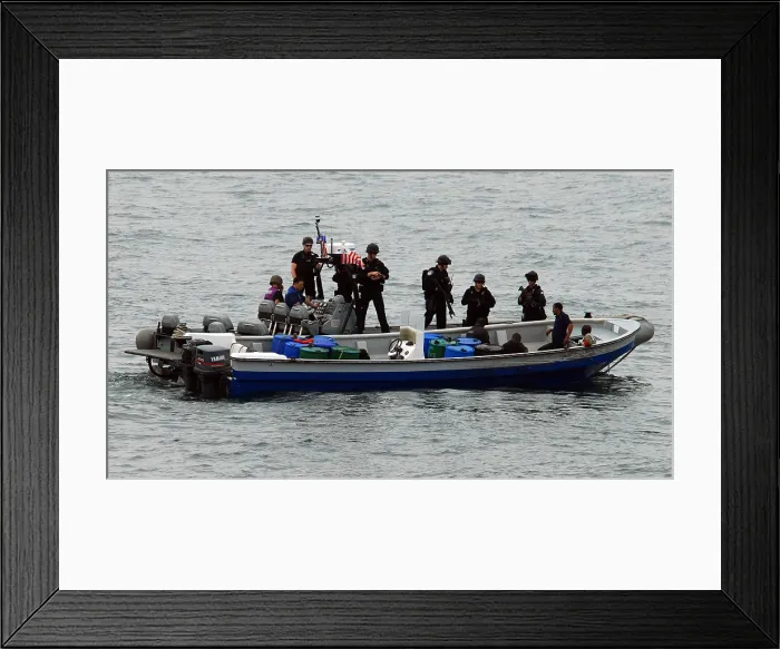 Framed Print : U.S. Sailors and Coast Guardsmen question four suspected drug smugglers after their boat was intercepted in the eastern Pacific Ocean March 31 2010 Framed Print : U.S. Sailors and Coast Guardsmen question four suspected drug smugglers after their boat was intercepted in the eastern Pacific Ocean March 31 2010