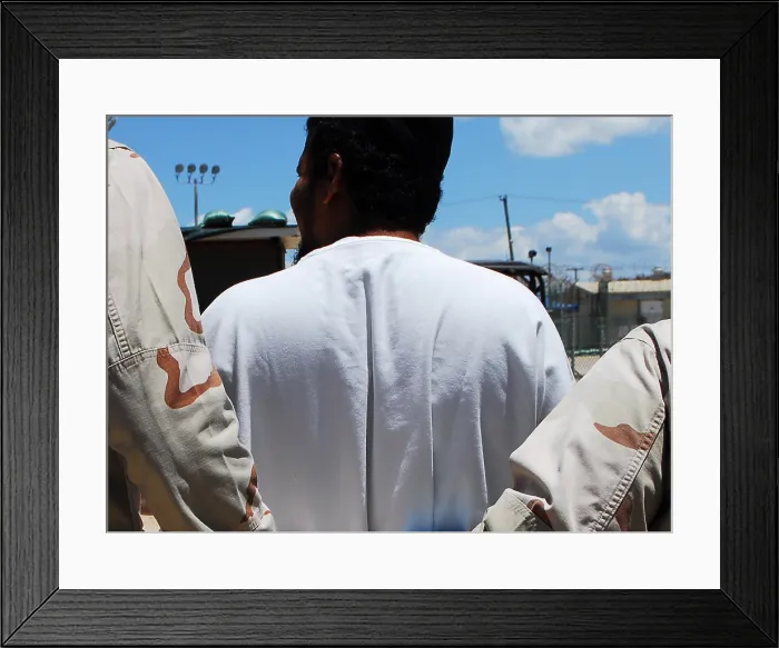 Framed Print : U.S. Sailors escort a detainee to an appointment at Camp 4 of the military prison at at Guantanamo Bay Naval Station Cuba