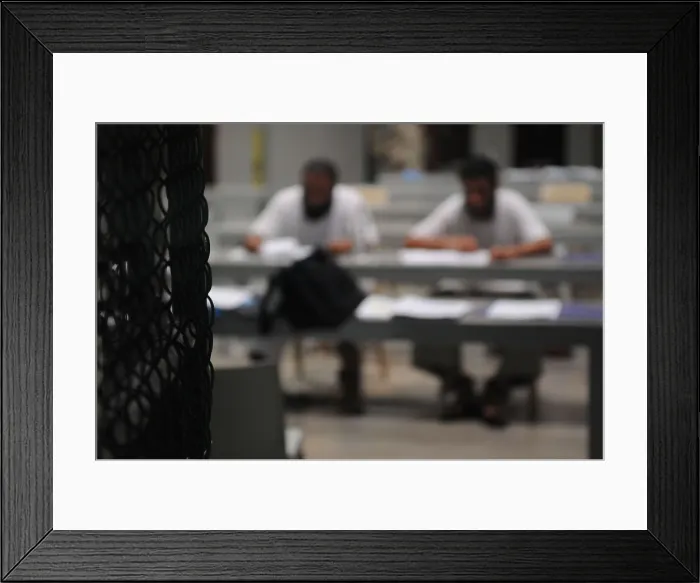 Framed Print : Detainees attend a class at Camp Delta military prison on Guantanamo Bay Naval Station. Courses are offered on life skills languages and art classes. Mar