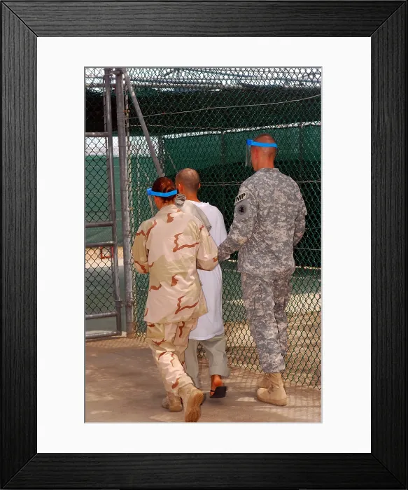 Framed Print : U.S. Army and Navy guards escort a detainee to Guantanamo Bay's Camp One recreational area where he could spend up to two hours a day Framed Print : U.S. Army and Navy guards escort a detainee to Guantanamo Bay's Camp One recreational area where he could spend up to two hours a day