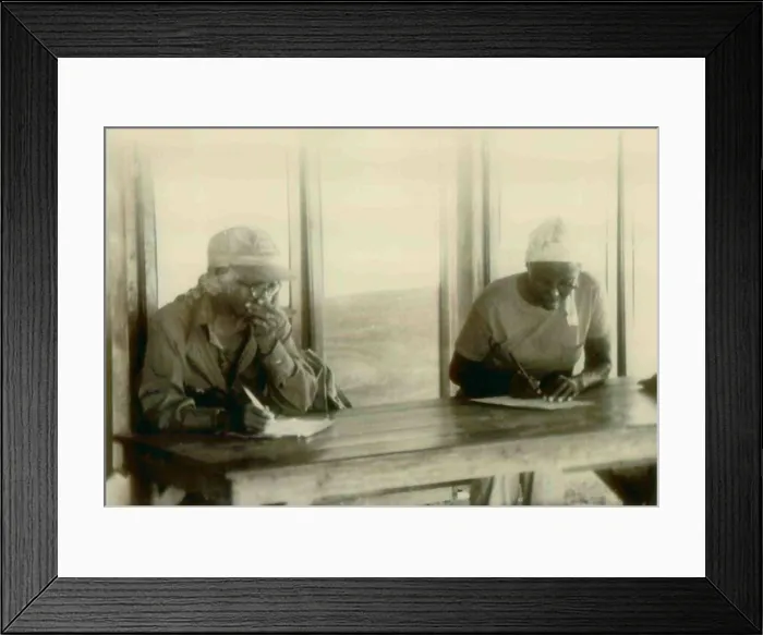 Framed Print : Two African American women in an adult education in class. People's Temple Agricultural Project. Jonestown, Guyana. Nov. 1978