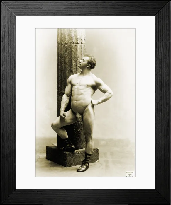 Framed Print : Eugen Sandow (1867-1925), the first professional body builder, standing nude by column. 1894