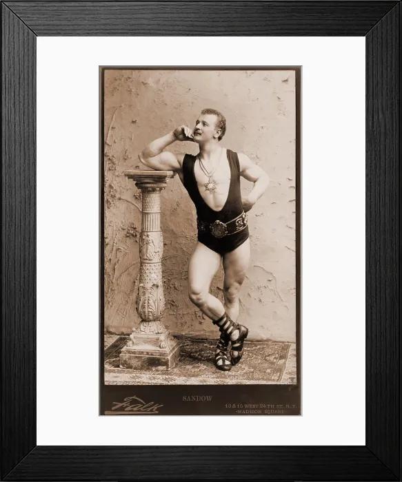 Framed Print : Eugen Sandow (1867-1925), German born strongman, wearing wrestling leotard, Roman sandals, and six pointed star pendant. 1894 Framed Print : Eugen Sandow (1867-1925), German born strongman, wearing wrestling leotard, Roman sandals, and six pointed star pendant. 1894