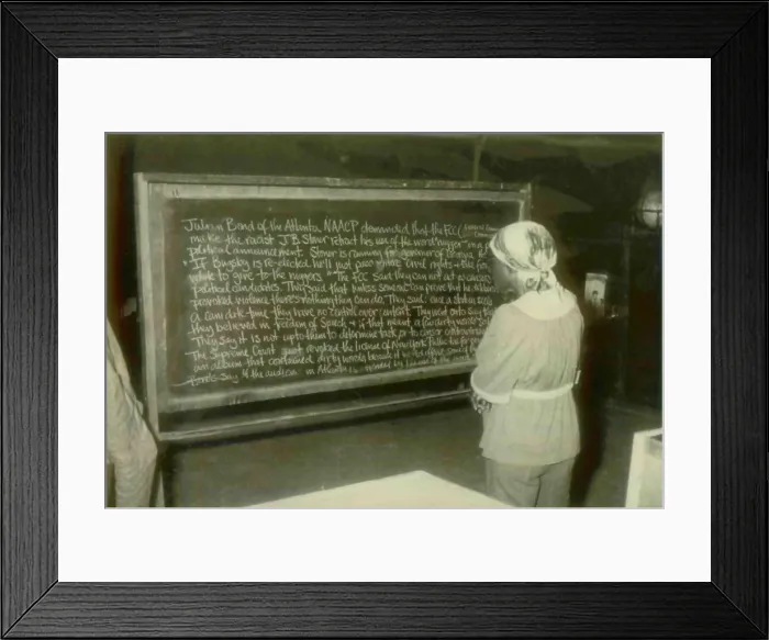 Framed Print : An adult education student reading about Julian Bond. People's Temple Agricultural Project. Jonestown, Guyana. Nov. 1978