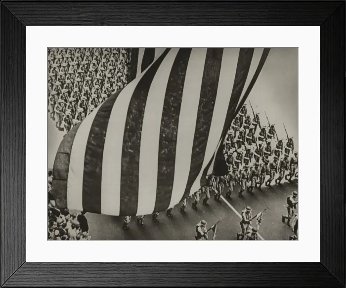 Framed Print : Dramatic photo of US flag and uniformed soldiers carrying rifles with bayonets fixed, marching in a parade during national mobilization in 1942 Framed Print : Dramatic photo of US flag and uniformed soldiers carrying rifles with bayonets fixed, marching in a parade during national mobilization in 1942