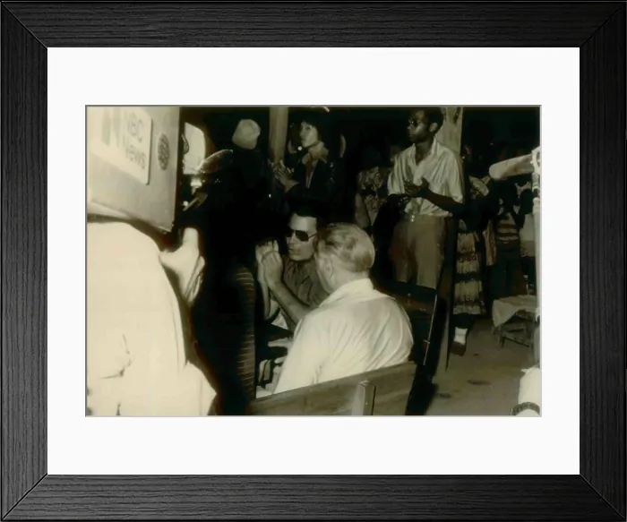 Framed Print : Jim Jones sitting with fact finding guests as an NBC cameraman records their conversation. In center maybe Congressman Leo Ryan. People's Temple Agricultural Project