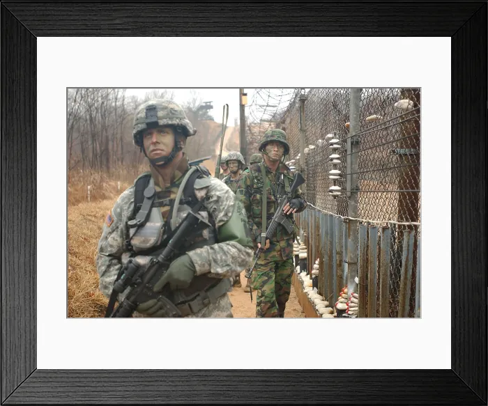 Framed Print : South Korean and US Soldiers patrol long a fence at the United Nations Security Area in Panmunjom during an annual training exercise. March 24 2007. (BSLOC_2011_12_198)