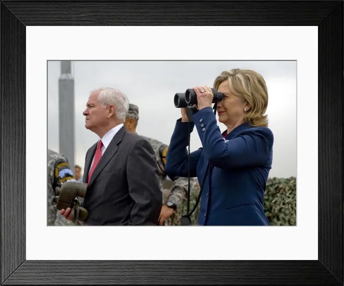 Framed Print : Hillary Clinton and Robert M. Gates look out over North Korea from Observation Point Ouellette during a tour of the Demilitarized Zone in South Korea. July 21 2010
