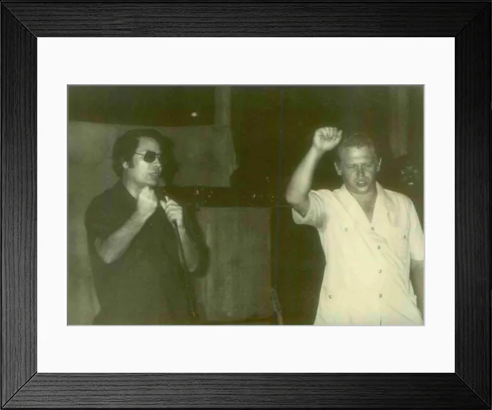 Framed Print : Jim Jones with a guest in Jonestown with visitors that accompanied Congressman Leo Ryan to Jonestown. People's Temple Agricultural Project. Jonestown, Guyana. Nov. 1978 Framed Print : Jim Jones with a guest in Jonestown with visitors that accompanied Congressman Leo Ryan to Jonestown. People's Temple Agricultural Project. Jonestown, Guyana. Nov. 1978