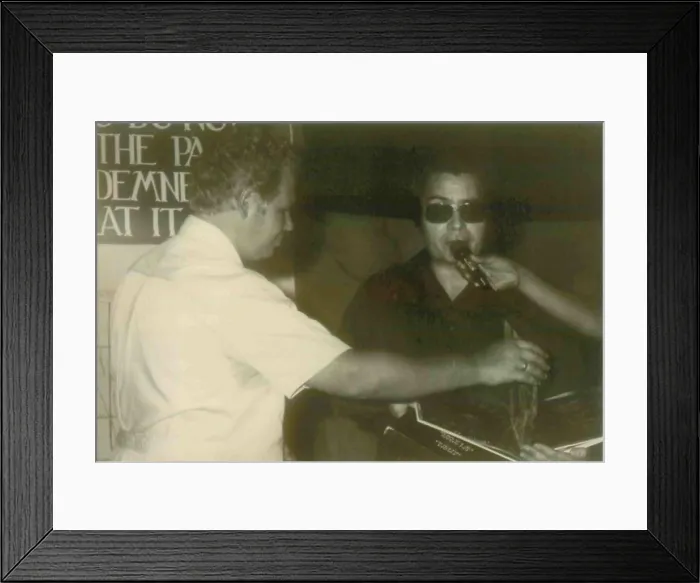 Framed Print : Jim Jones with one of the fact finding visitors that accompanied Congressman Leo Ryan to Jonestown. People's Temple Agricultural Project. Jonestown, Guyana. Nov. 1978