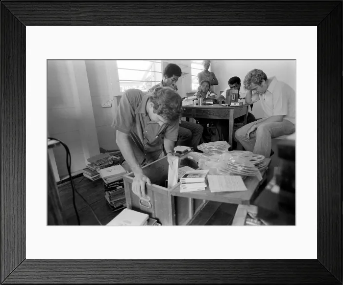 Framed Print : FBI agents in Jonestown, going through files and tapes. The materials were left by People's Temple in Jonestown, Guyana after their mass suicide of Nov. 18, 1978