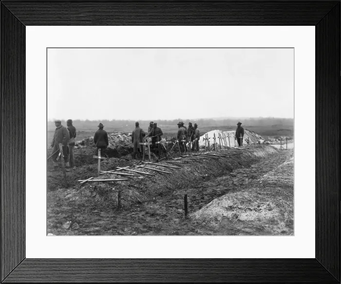 Framed Print : African-American soldiers of the 321st Labor Battalion in the segregated U.S. Army during World War I. They are filling trenches in which American dead are buried. December 1918