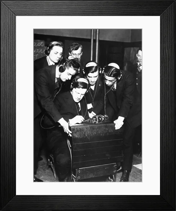 Framed Print : Student transmitting a message to four of his classmates in a radio class at the Stuyvesant Evening High School, N.Y