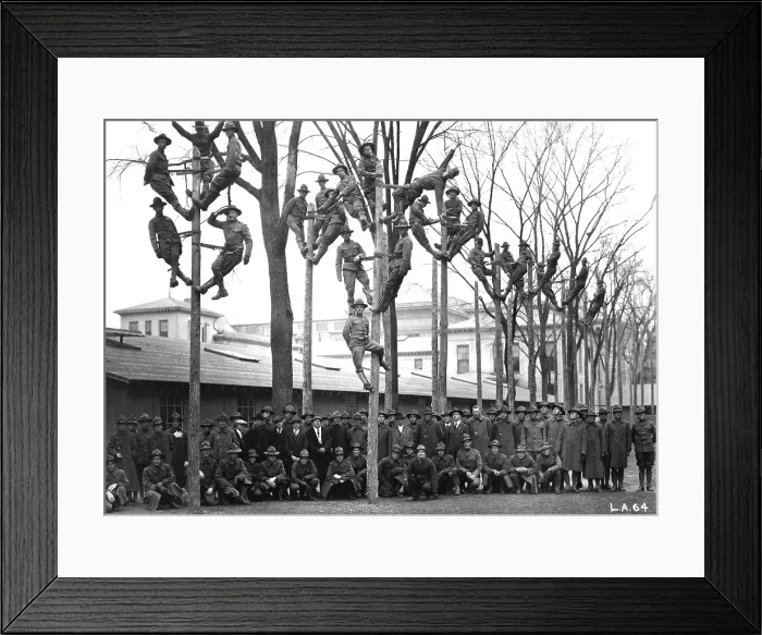 Framed Print : Pole-Climbing training for Students Army Training Corps at the University of Michigan. The uniformed students are in a course for telephone electricians. World War I. Ca. 1918