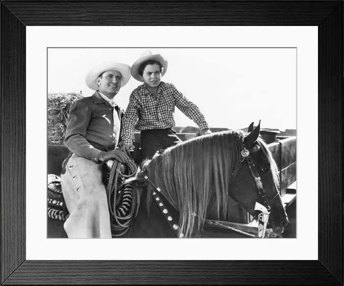 Framed Print : THE LAST ROUND-UP, from left, Gene Autry, Robert Blake, (billed as Bobby Blake), 1947