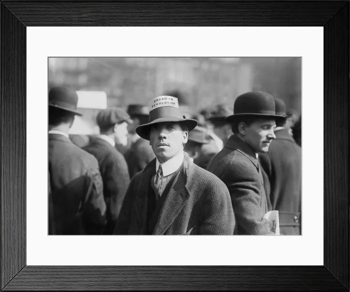 Framed Print : Man wearing a Industrial Workers of the World Hat Card reading Bread or Revolution in a rally at New York City's Union Square. Ca. 1914 Framed Print : Man wearing a Industrial Workers of the World Hat Card reading Bread or Revolution in a rally at New York City's Union Square. Ca. 1914