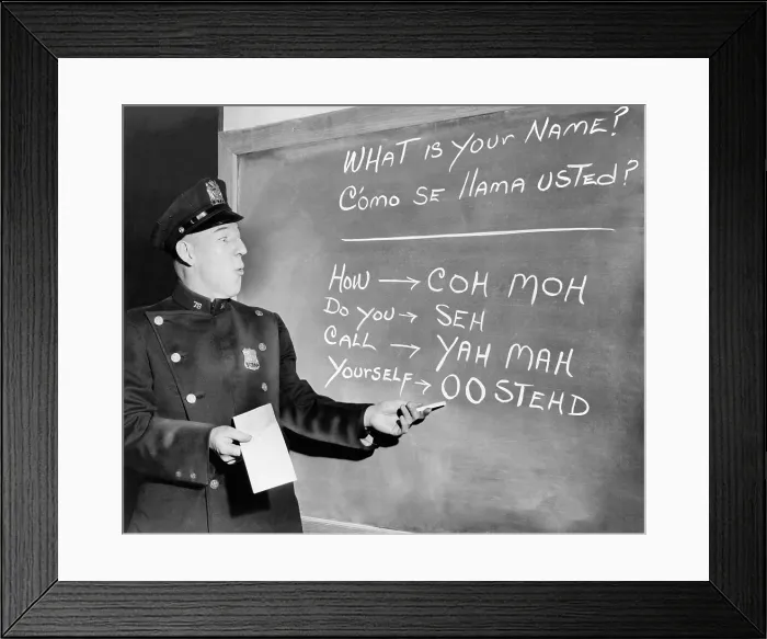 Framed Print : New York Police Officer Richard Perry practices basic Spanish phrases using phonetic syllables written on blackboard. Ca. 1955 Framed Print : New York Police Officer Richard Perry practices basic Spanish phrases using phonetic syllables written on blackboard. Ca. 1955