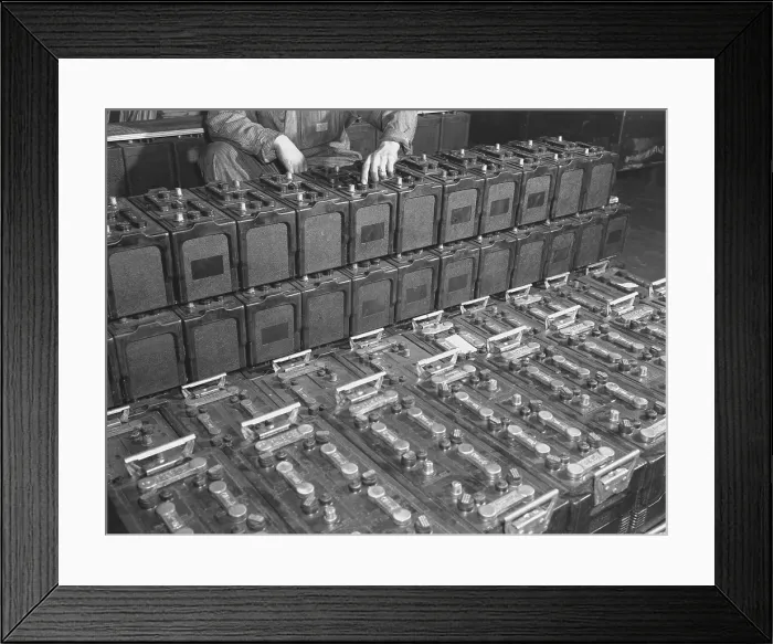 Framed Print : Dozens of 12 volt rechargeable automobile batteries at a the White Motor Company, Cleveland, Ohio. 1941