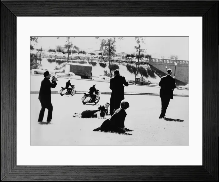 Framed Print : Seconds after John F. Kennedy's assassination two policemen on motorcycles speed by as some spectators cower on the ground, while three continue to take pictures. Nov Framed Print : Seconds after John F. Kennedy's assassination two policemen on motorcycles speed by as some spectators cower on the ground, while three continue to take pictures. Nov