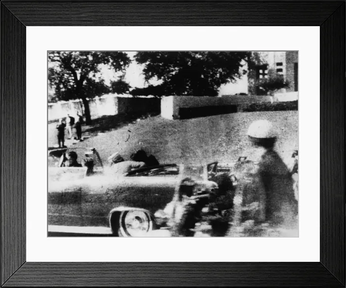 Framed Print : First Lady Jacqueline Kennedy turns to the wounded John Kennedy in the Presidential limousine during his assassination on November 22, 1963 Framed Print : First Lady Jacqueline Kennedy turns to the wounded John Kennedy in the Presidential limousine during his assassination on November 22, 1963