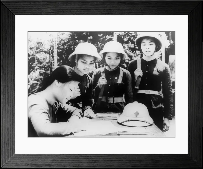Framed Print : North Vietnamese woman joins People's Army of Vietnam. A young woman member of the Hanoi woman's militia, enlists in the army to fight with North Vietnamese forces. 1965