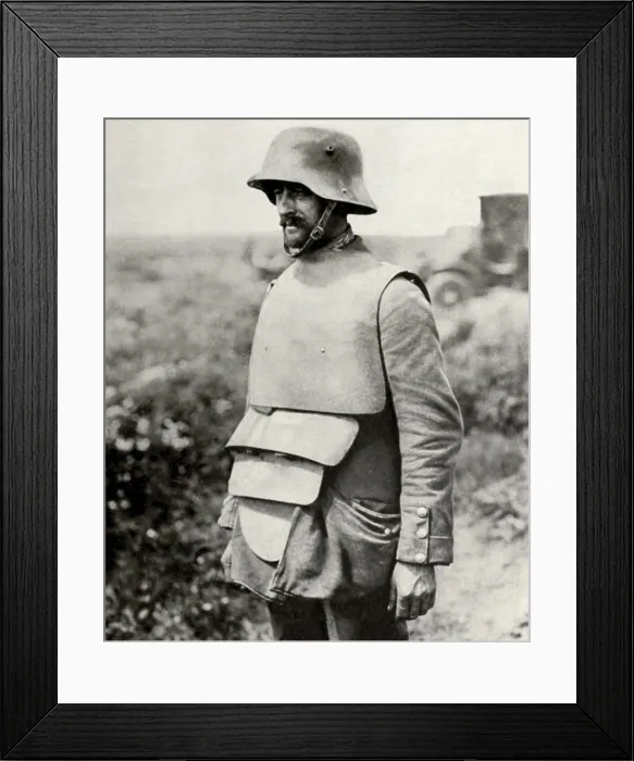 Framed Print : German soldier in metal helmet design of 1916 and old fashioned body armor. 1916-18. (BSLOC_2013_5_46)