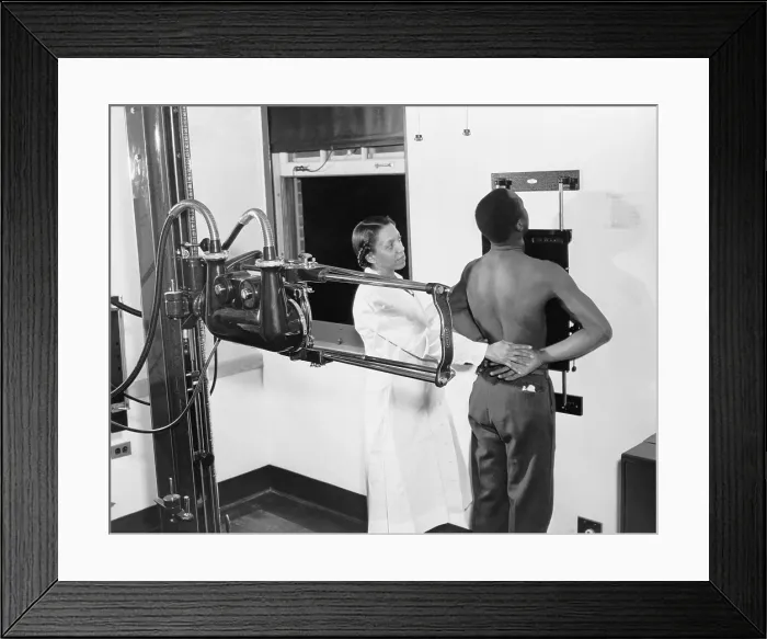 Framed Print : Nurse placing patient in the correct position for taking a chest X-ray for use in the diagnosis of tuberculosis at the Southwest health center in 1937 Framed Print : Nurse placing patient in the correct position for taking a chest X-ray for use in the diagnosis of tuberculosis at the Southwest health center in 1937