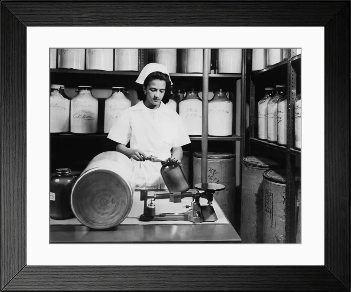 Framed Print : Technician fills brown glass jar with hormones derived from wild poisonous yam, in laboratory in Mexico City. 1951 Framed Print : Technician fills brown glass jar with hormones derived from wild poisonous yam, in laboratory in Mexico City. 1951