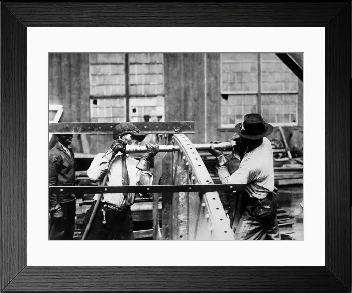 Framed Print : Charles Knight (left) who won the prize offered by the London Mail for expert rivet driving. He drove 4, 875 rivets in nine hours in a Government shipyard. World War I. Ca. 1918