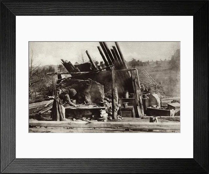 Framed Print : World War 1. Russian peasant woman in her battle ruined home on the Eastern Front. She placed her baby in the cradle at right and is attempting to prepare a meal. Ca. 1915 Framed Print : World War 1. Russian peasant woman in her battle ruined home on the Eastern Front. She placed her baby in the cradle at right and is attempting to prepare a meal. Ca. 1915