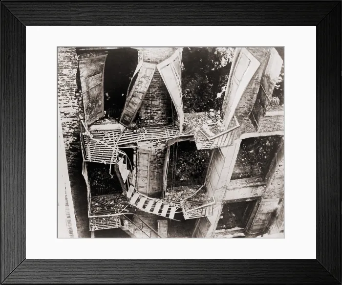 Framed Print : Triangle Shirtwaist Factory fire escape collapsed during the March 15, 1911 fire. 146 died, either from fire, jumping or falling to the pavement