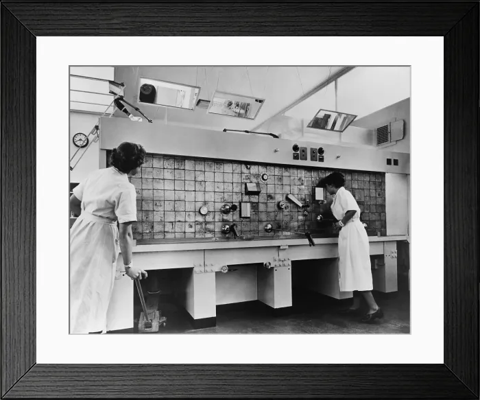Framed Print : Peaceful use of atom. Two female technicians prepare radioactive isotopes for medical and industrial use