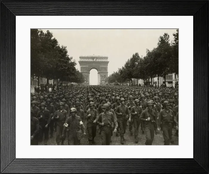 Framed Print : World War II. The liberation of Paris. Victorious American soldiers marching down the Champs Elysees with the Arch de Triomphe behind them on August 26, 1944 Framed Print : World War II. The liberation of Paris. Victorious American soldiers marching down the Champs Elysees with the Arch de Triomphe behind them on August 26, 1944