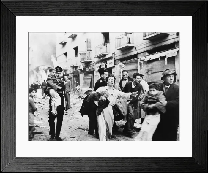 Framed Print : Mother and her family fleeing from square block of buildings in the Jewish district of Jerusalem, which were blasted to rubble in February 1948. Photo by Lasar Dunner