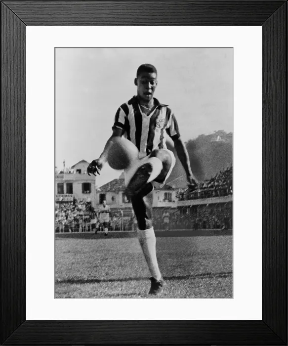 Framed Print : Pele (b. 1940), the Brazilian soccer player in 1965, at the height of his long career which included three World Cup championships Framed Print : Pele (b. 1940), the Brazilian soccer player in 1965, at the height of his long career which included three World Cup championships