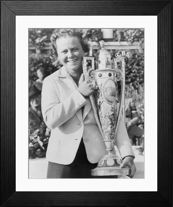 Framed Print : Patty Berg, (1918-2006), holds her trophy after winning the National Women's Golf Championship at the Westmoreland Country Club. Sept. 25, 1938