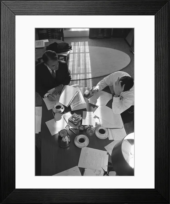 Framed Print : Overhead view of Jack Valenti and Joseph Califano preparing President Johnson's 1966 State of the Union Address. Jan. 12, 1966