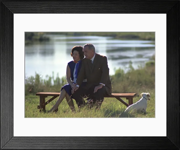 Framed Print : Lady Bird and President Johnson sit outdoors at the Pedernales River on the LBJ Ranch, near Stonewall, Texas. Sept. 30, 1967