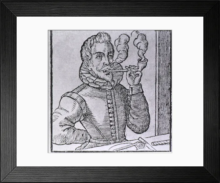 Framed Print : 16th century Dutchman smoking a long-stemmed pipe, with another pipe and roll of tobacco on the table