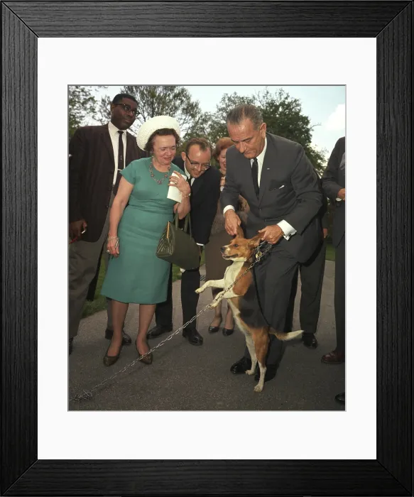 Framed Print : President Lyndon Johnson holds his beagle up by the ears as members of the press look on. May 4, 1964