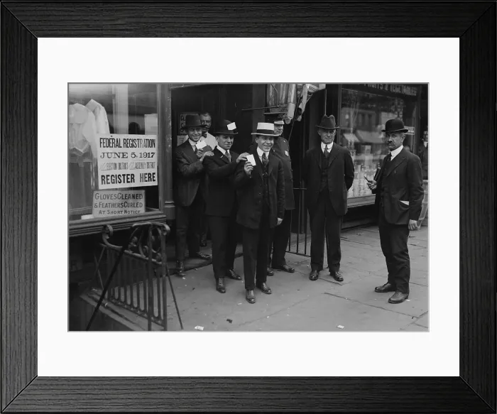 Framed Print : World War 1. American men display their draft cards after registering for conscription in New York City. June 1917 Framed Print : World War 1. American men display their draft cards after registering for conscription in New York City. June 1917