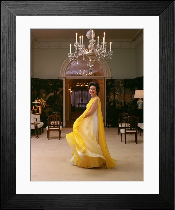 Framed Print : Lady Bird Johnson in a flowing, multilayer yellow chiffon evening dress. May 8, 1968 Framed Print : Lady Bird Johnson in a flowing, multilayer yellow chiffon evening dress. May 8, 1968