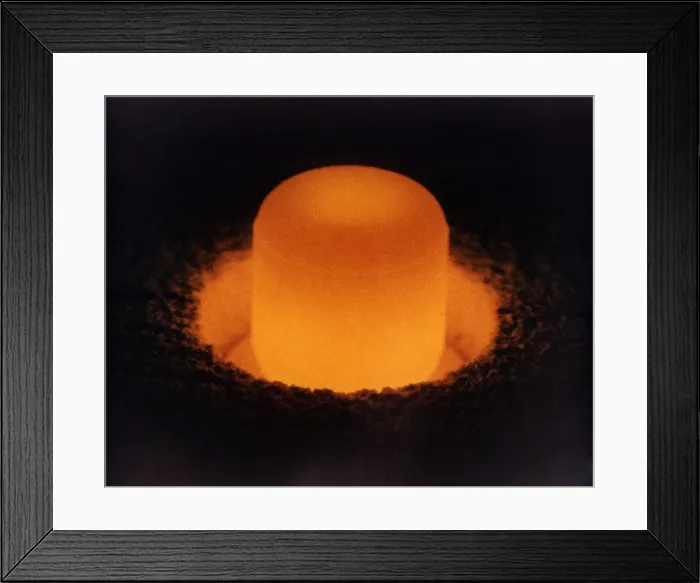Framed Print : Pellet of Plutonium-238 glowing from its own heat. Plutonium-238 is used to fuel space probes as a sustained power source for a long voyages with little weight or mass