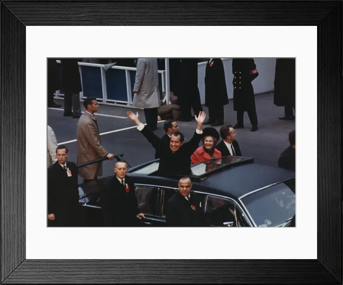 Framed Print : President and Pat Nixon waving to the crowd from the Presidential limousine in the Inaugural motorcade. Jan 20 1969