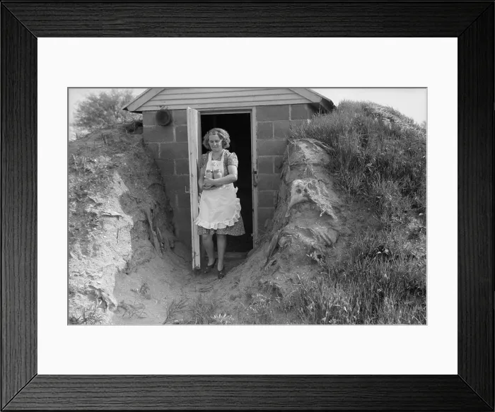 Framed Print : Young woman retrieves home canned food from her sturdy food storage cellar Framed Print : Young woman retrieves home canned food from her sturdy food storage cellar