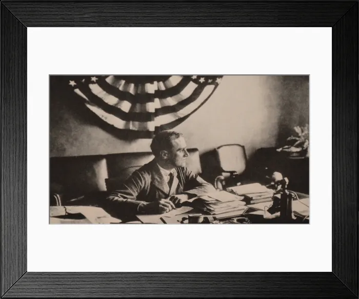 Framed Print : Franklin Roosevelt in his Hyde Park study in 1923. The striped bunting, correspondence, and telephone indicate FDR is back at work. (BSLOC_2013_8_1)