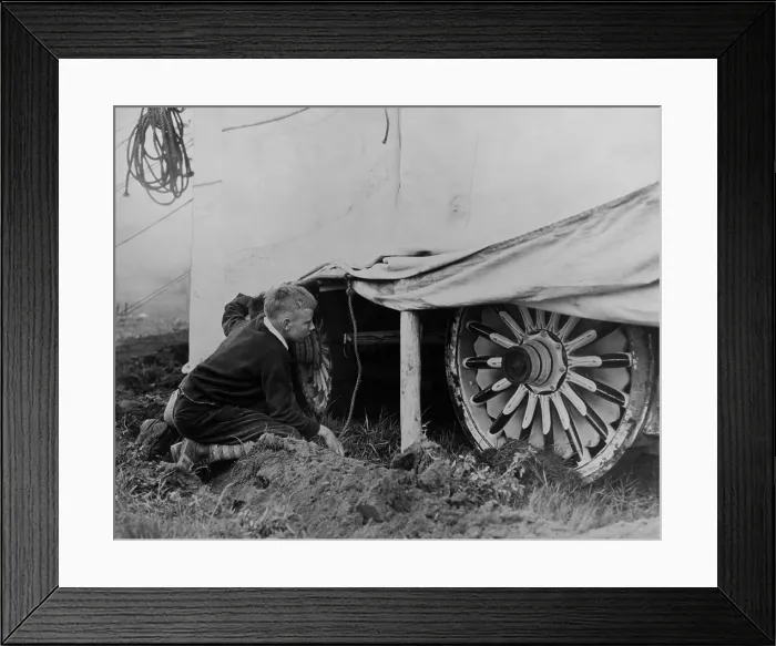Framed Print : Boy looking under a circus tent to catches a glimpse of the show, ca. 1935. (BSLOC_2013_8_105)